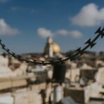 selective focus photography of black barbwire