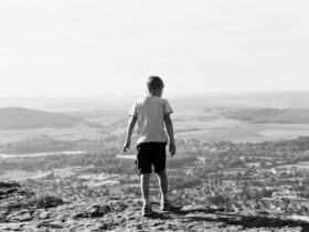 boy standing on field