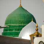 a green dome and a white dome on a building