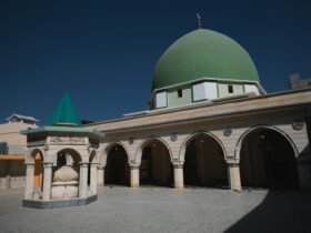 white and green dome building under blue sky during daytime