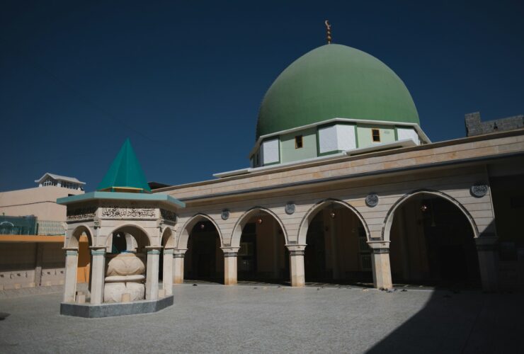 white and green dome building under blue sky during daytime