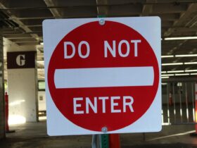 white and red do not enter signboard