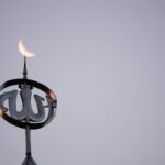 a close up of a clock on top of a building