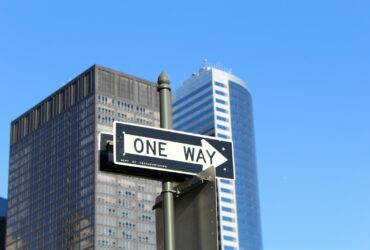 One Way signage on high-rise building