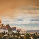 A city with a lot of smoke coming out of it