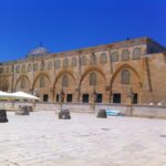 brown concrete building under blue sky during daytime