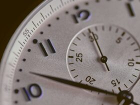 a close up of a silver watch face