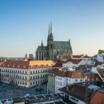 a view of a city with a cathedral in the background