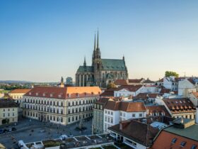a view of a city with a cathedral in the background