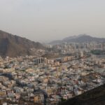 a view of a city with mountains in the background
