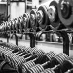 gray scale photo of dumbbells
