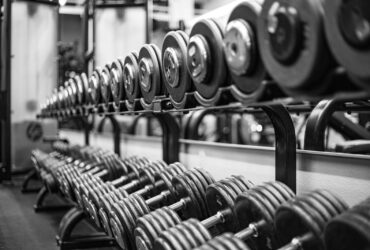 gray scale photo of dumbbells