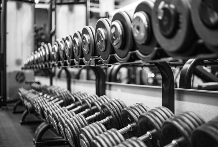 gray scale photo of dumbbells