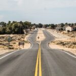gray asphalt road under white sky during daytime