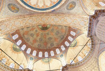 Intricate domes and ceiling adorn a historic mosque