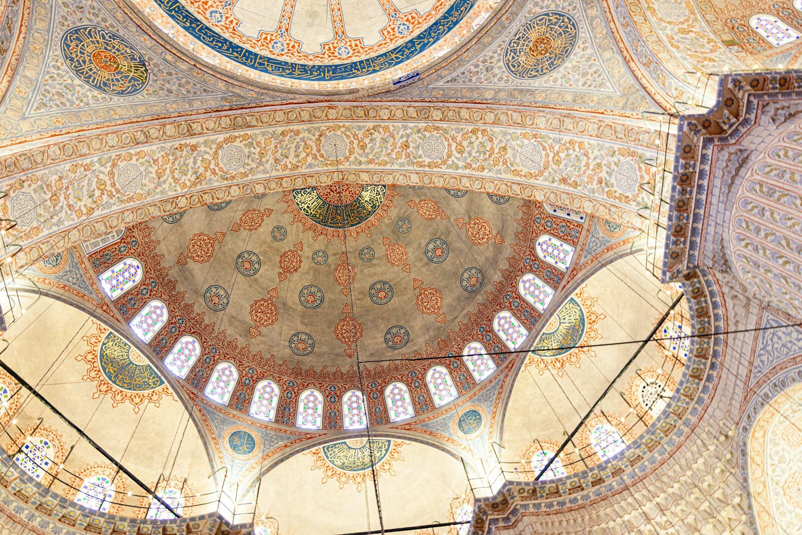 Intricate domes and ceiling adorn a historic mosque
